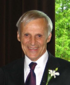 Photo of a smiling older man, with gray hair, Ray Desjardins, CMOS member.