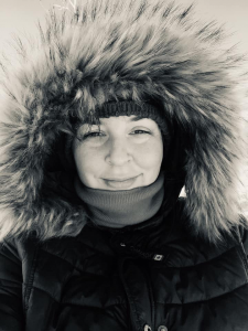 Nicole Renaud, a young Caucasian woman in a parka with a furry hood.